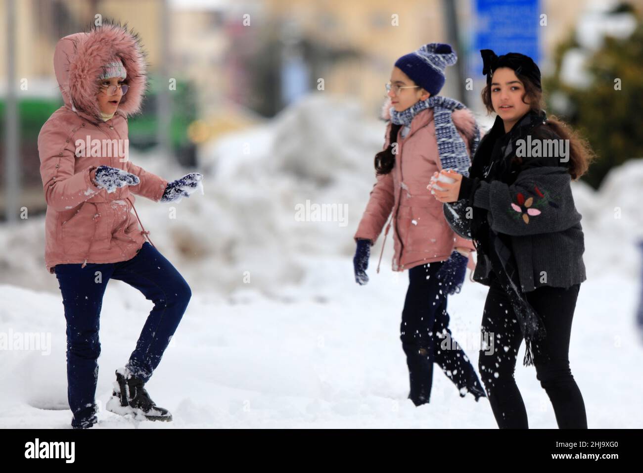 Amman, Jordan. 27th Jan, 2022. People play with snow in Amman, Jordan, on  Jan. 27, 2022. A major power outage hit many cities in Jordan on Thursday  after a heavy snow blanketed