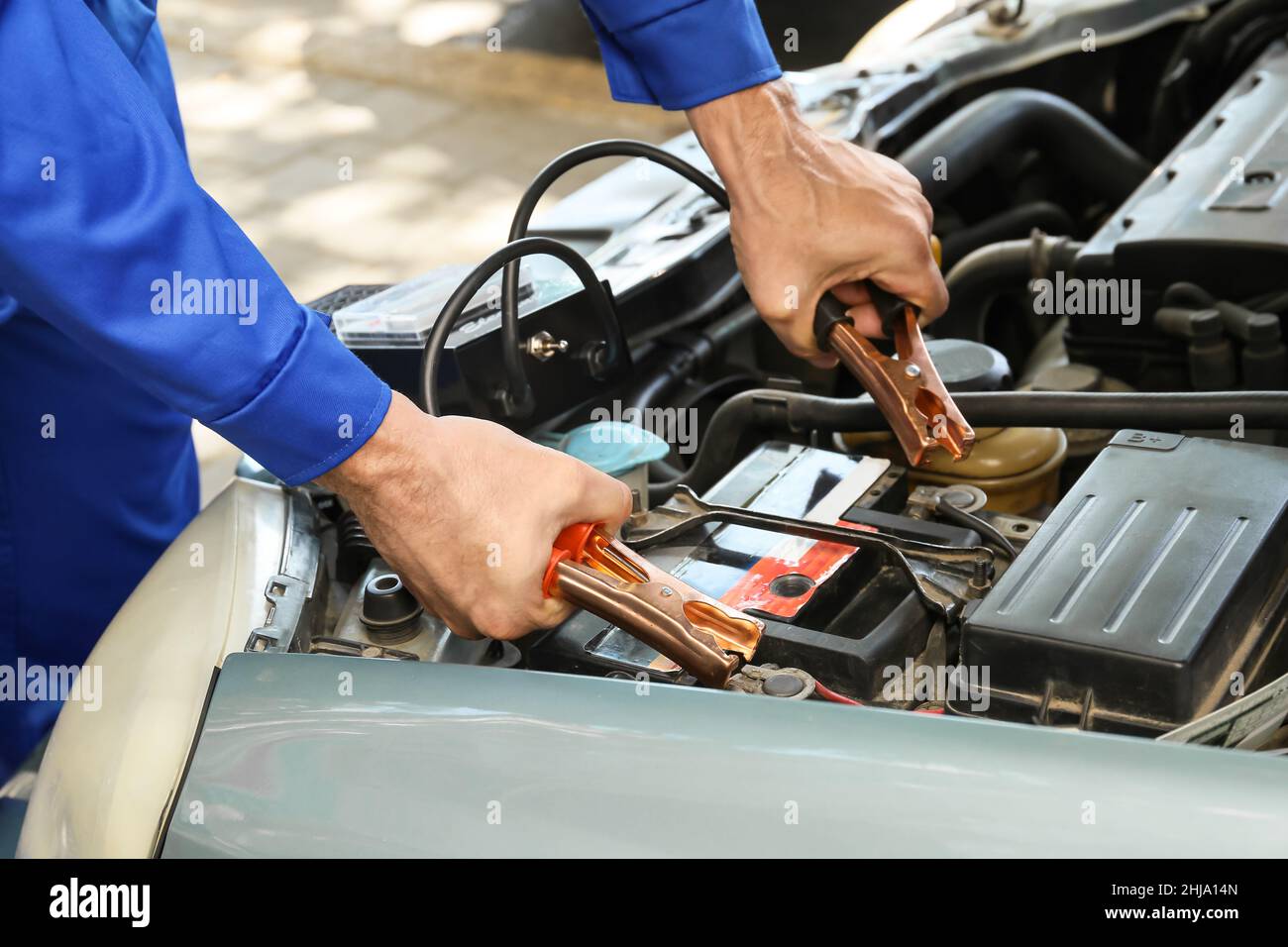 Man testing modern car battery Stock Photo Alamy