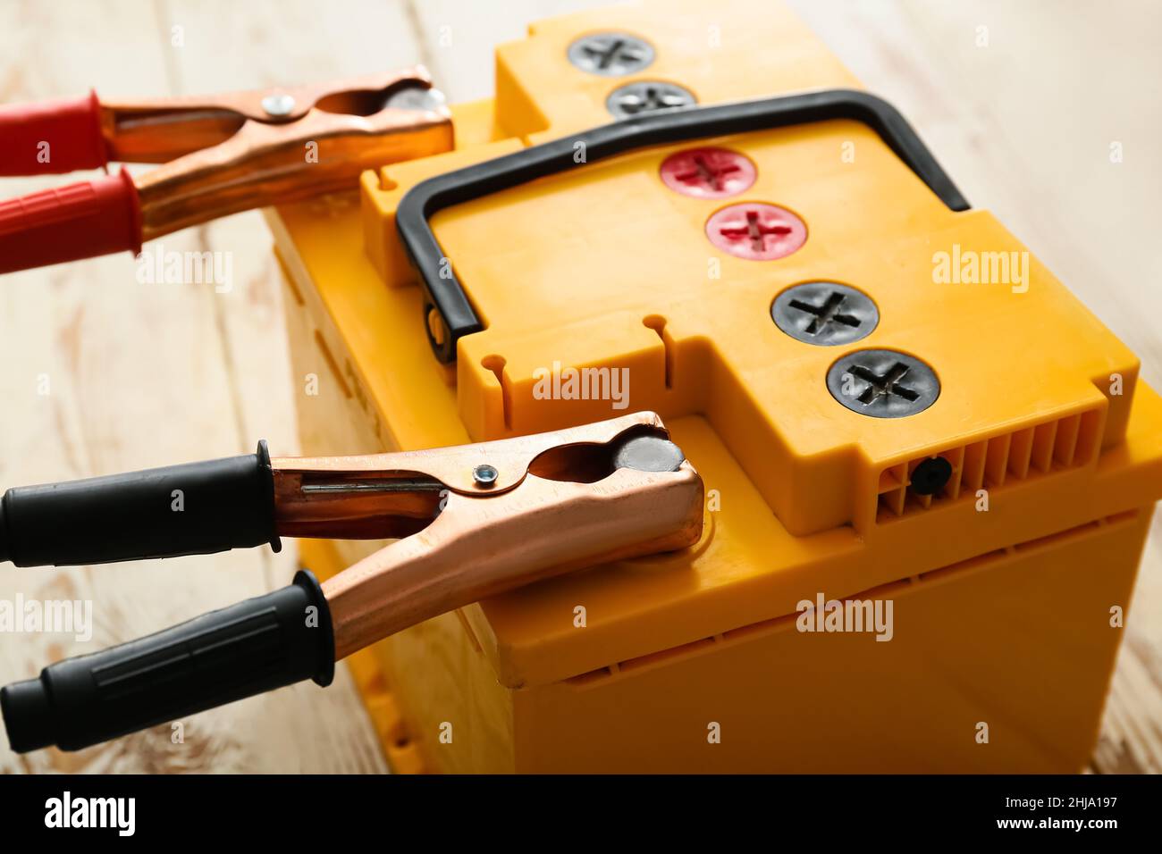 Charging of modern car battery, closeup Stock Photo Alamy