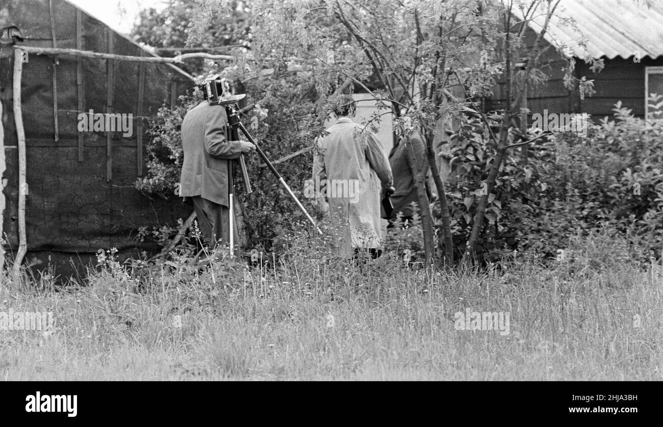Police Forensics examine Land Rover at Leatherslade Farm, believed to have been used in raid, Wednesday 14th August 1963. The 1963 Great Train Robbery was the robbery of 2.6 million pounds from a Royal Mail train heading from Glasgow to London on the West Coast Main Line in the early hours of 8th August 1963, at Bridego Railway Bridge, Ledburn, near Mentmore in  Buckinghamshire, England. Stock Photo