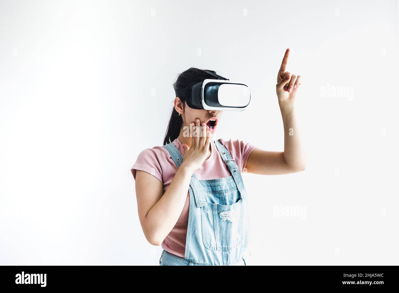 young latin woman with glasses of virtual reality on a white background