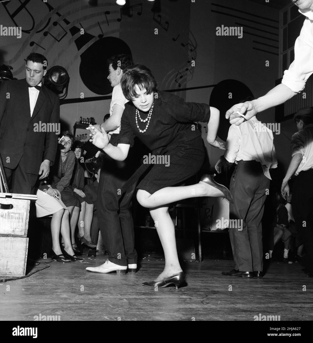 Teenage contestants during a 32-hour twisting competition at Embers Ballroom, Harlow, Essex. 12th February 1962. Teenagers take part in dance competition - winner does the Twist for over 32 hours!  Non-stop Twist in Harlow, Essex.  People taking part in a Twist Competition. They are hoping to beat the American record of 18 hours and 4 minutes of non-stop dancing. The over-all winner who danced for 32 hours and 31 minutes Stock Photo