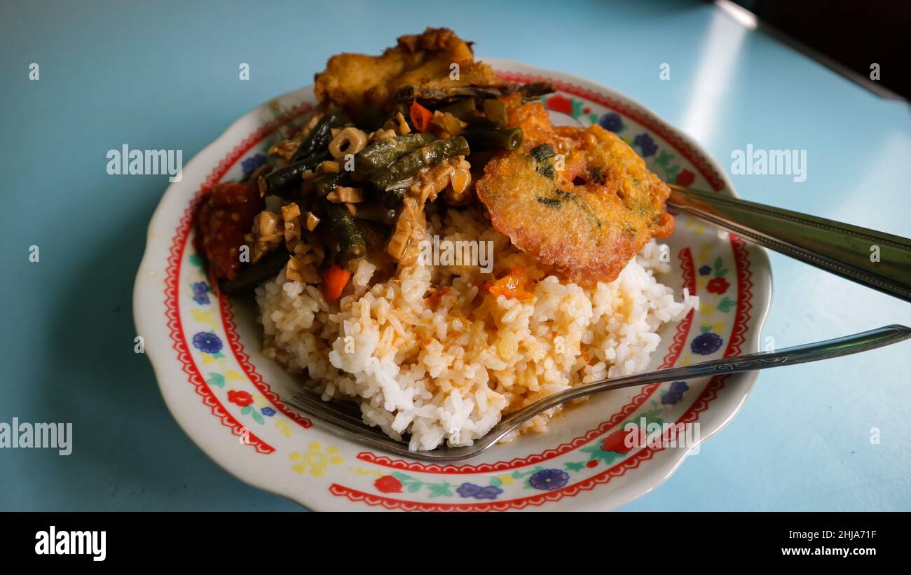 The majority of Indonesians really like mixed rice menus like this Stock Photo