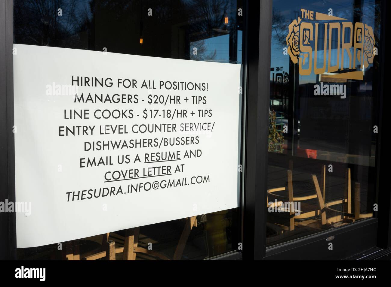 A hiring ad for all positions with promised hourly rates is seen at the Sudra, a vegan restaurant in Beaverton, Oregon, on Tuesday, January 25, 2022. Stock Photo