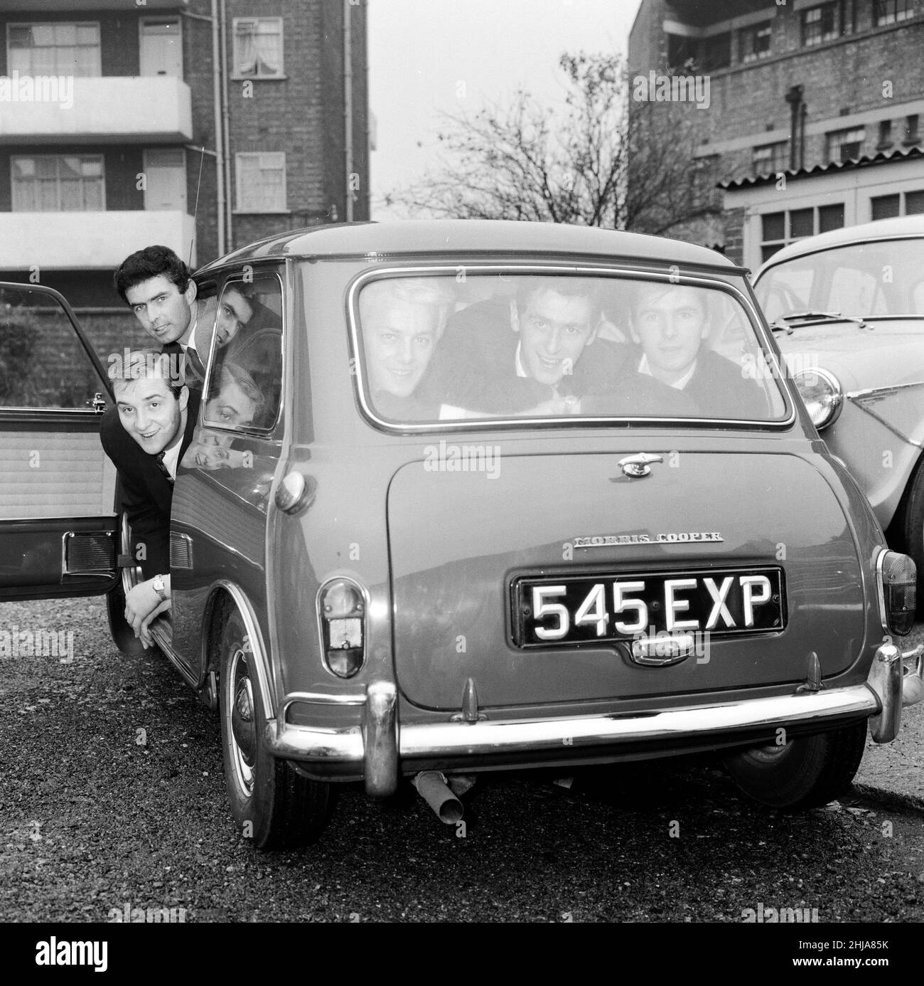 The five members of the Tornados pop group Heinz Burt, George Bellamy, Roger Lavern, Alan Caddy and Clem Cattini all squeezed into a Morris Mini cooper. 7th November 1962. Stock Photo
