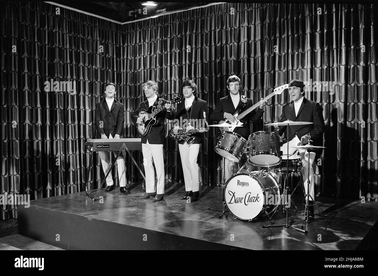The Dave Clarke Five filming at MGM's Boreham Wood studio in Hertfordshire, for the new romantic musical comedy 'The Go Go Set' Left to right: Mike Smith (lead vocals and keyboards organ) Lenny Davison (guitar) Denis Patton (saxophone) Rick Huxley (bass guitar) Dave Clark (drums)  Picture taken 2nd September 1964 Stock Photo