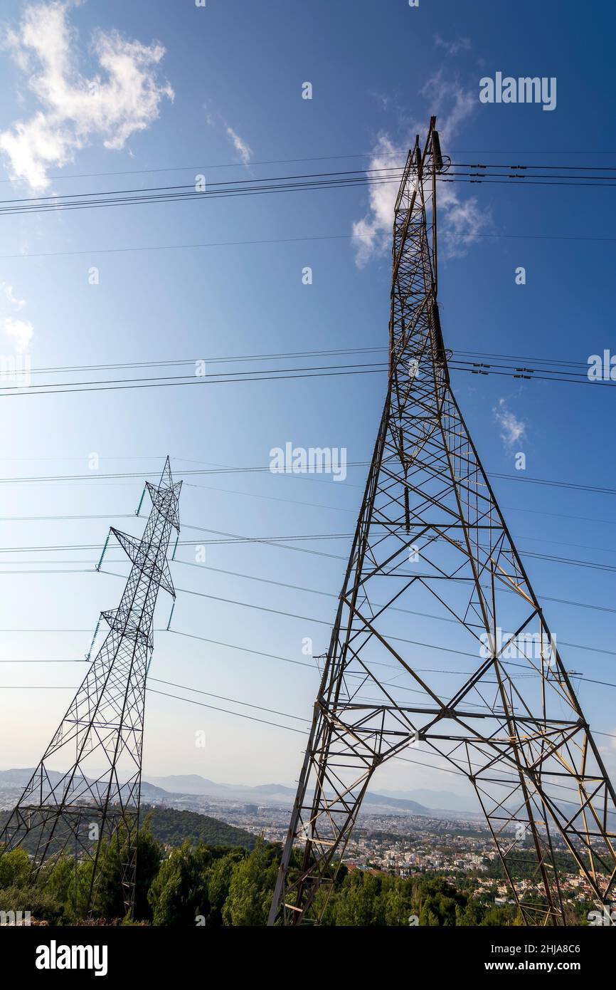 High voltage power lines on the mountain of penteli, Greece Stock Photo ...
