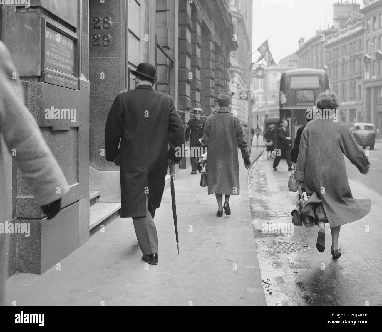 A city banker seen here arriving at his office at the Bank of New South Wales in the city of London. Circa 1963 Stock Photo