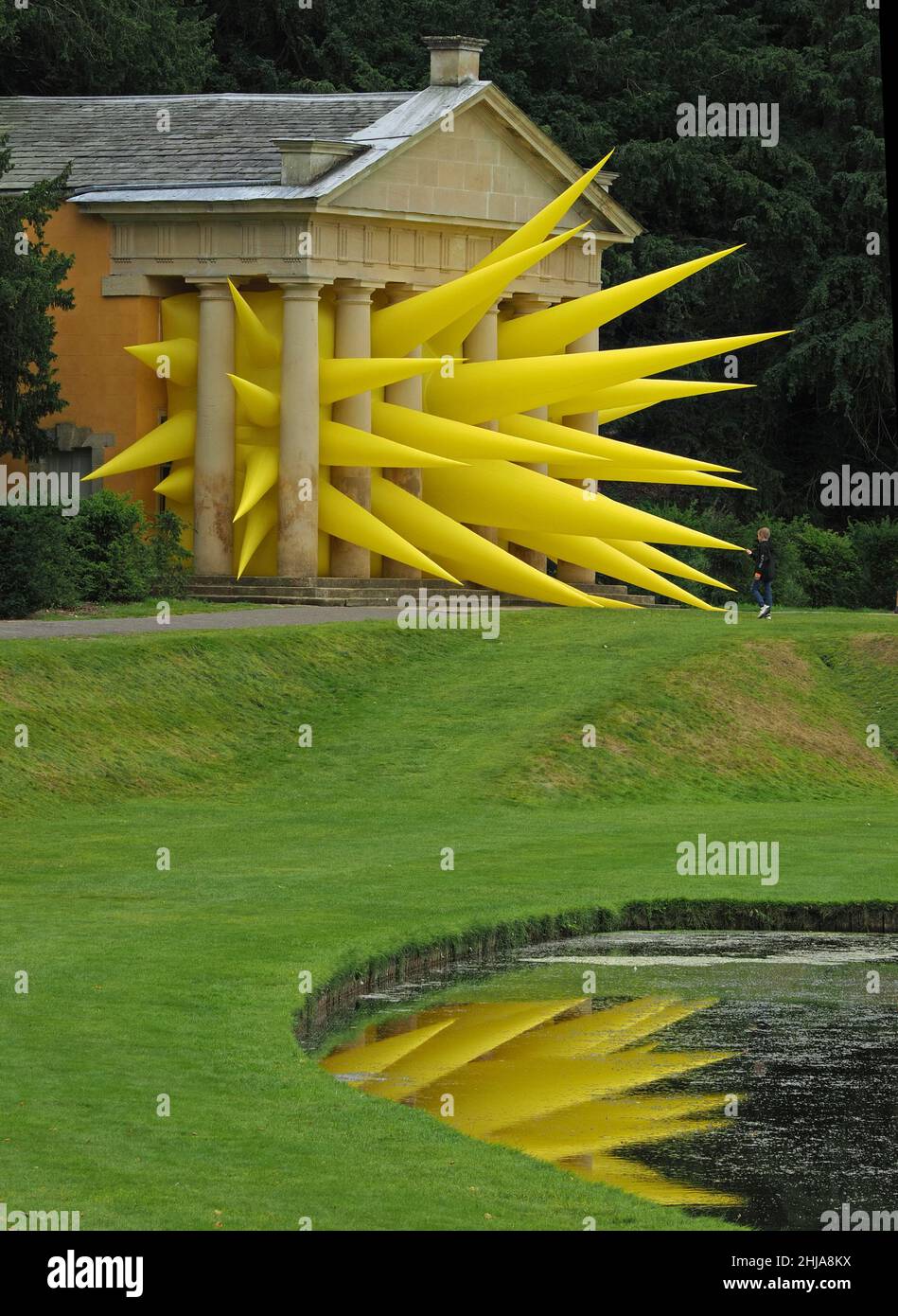 Art installation - Spiked - anonymous distant teenager explores inflatable artwork by Steve Messam at Fountains Abbey in North Yorkshire, England, UK Stock Photo