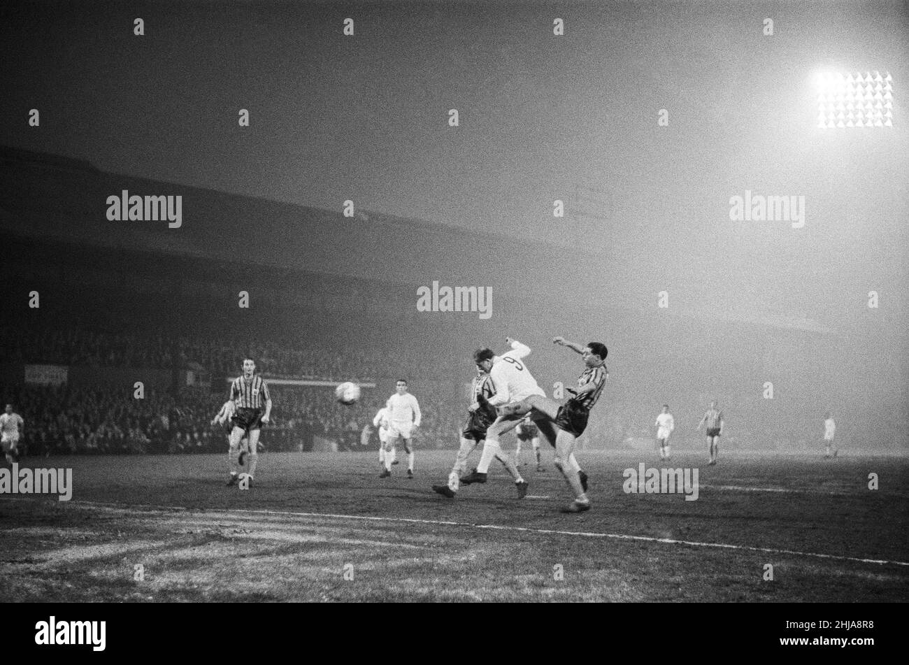 Crystal Palace played Real Madrid at Selhurst Park, on the night of 18th April 1962, to mark the new floodlighting system. The final score was Crystal Palace 3 Real Madrid 4. Pictured scoring a goal with his head for Real madrid is legendary forward Alfredo Di Stefano. Stock Photo