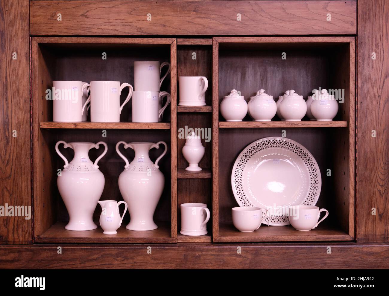 close up view of beautiful wooden display case with pottery items in  Burleigh  pottery factory shop. Stock Photo