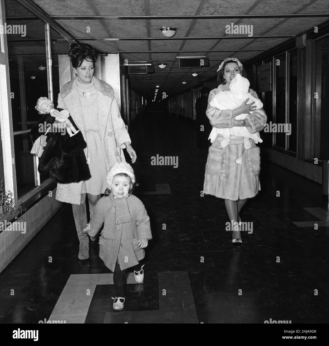 Joan Collins arriving by British European Airways from Paris with her daughter Tara, sister Jackie and Jackie's daughter Tracy. 20th February 1964. Stock Photo