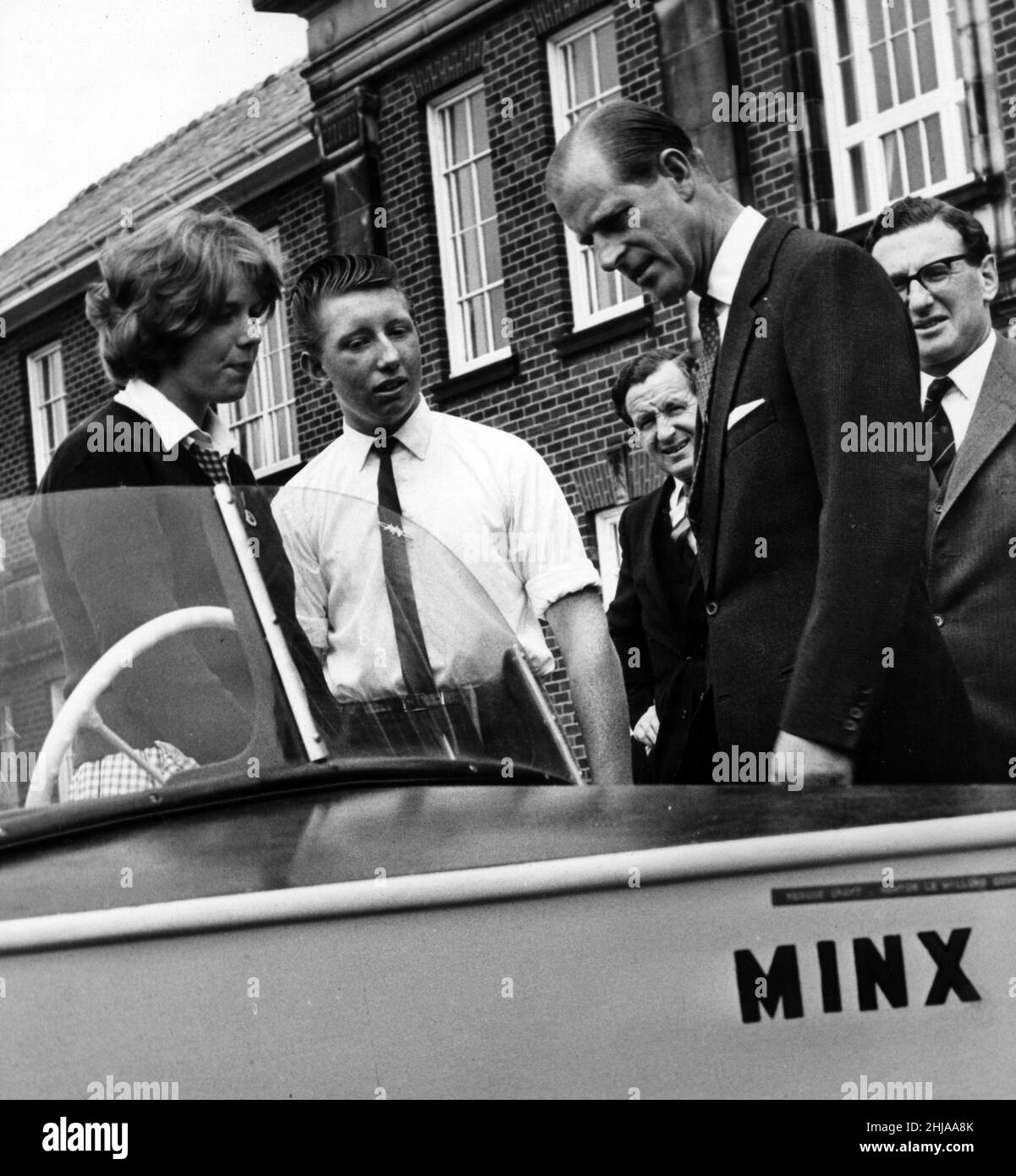 Sandra Leamer, 15, and Jim Brown, 14, both from Newton-le-Willows, show off their speedboat 'Minx' to Prince Philip, Duke of Edinburgh, which was built by pupils of Newton-le-Willows County Secondary School. 14th June 1963. Stock Photo