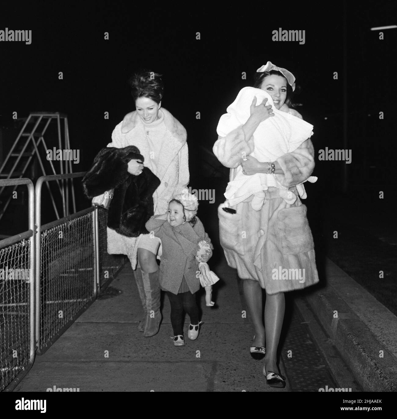 Joan Collins arriving by British European Airways from Paris with her daughter Tara, sister Jackie and Jackie's daughter Tracy. 20th February 1964. Stock Photo