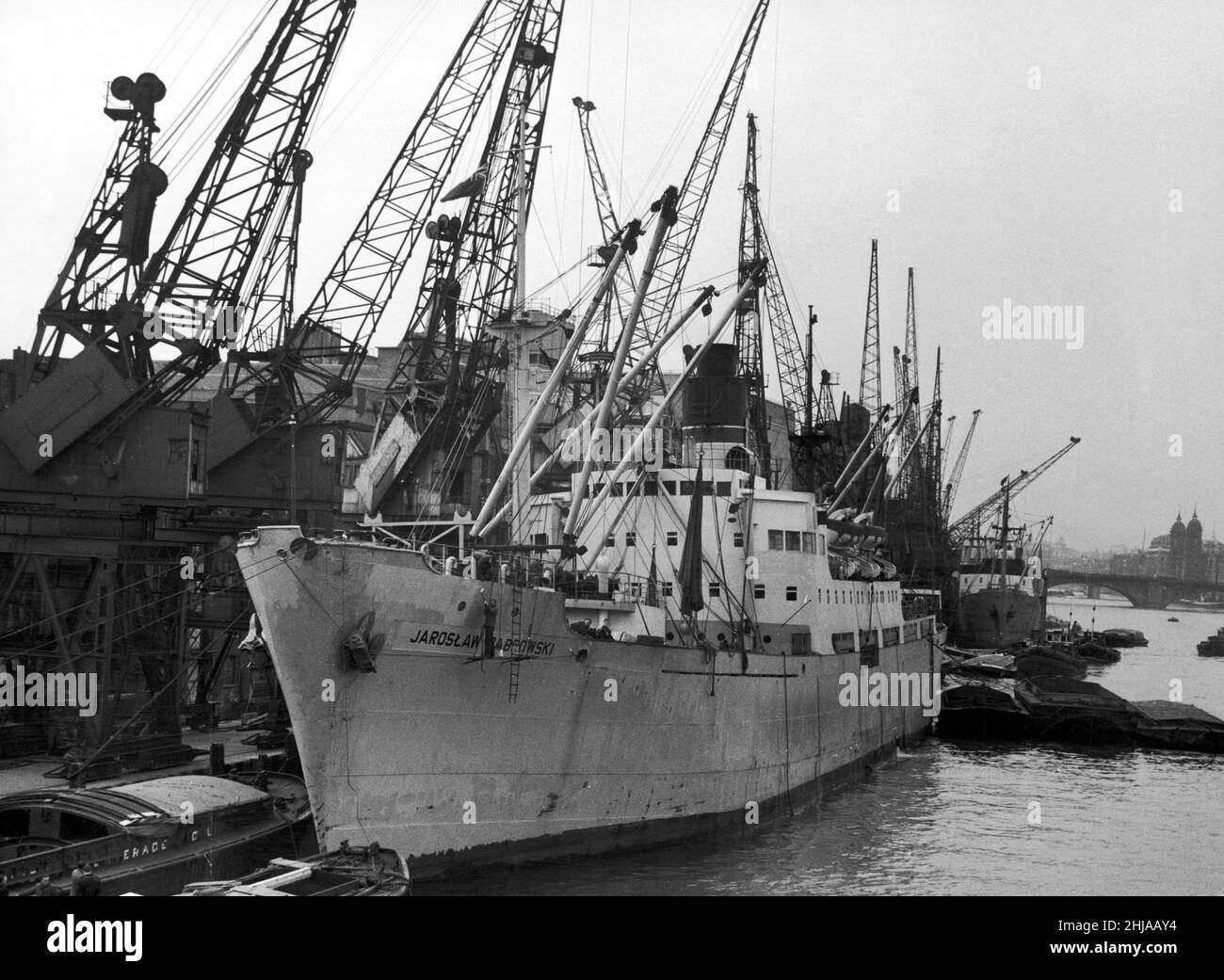 London Dockers rescue 3 Polish stowaways from the hold of Polish ship 'Jaroslaw Dabrowski' berthed near Tower Bridge. 20th March 1962 Stock Photo