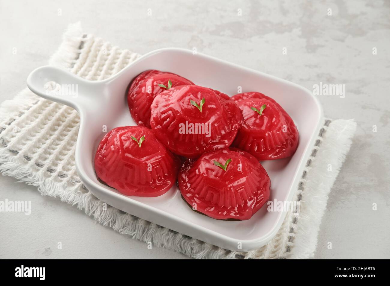 Ang Kue (Kue Ku) or Kue Thok, steamed Chinese pastry of glutinous rice