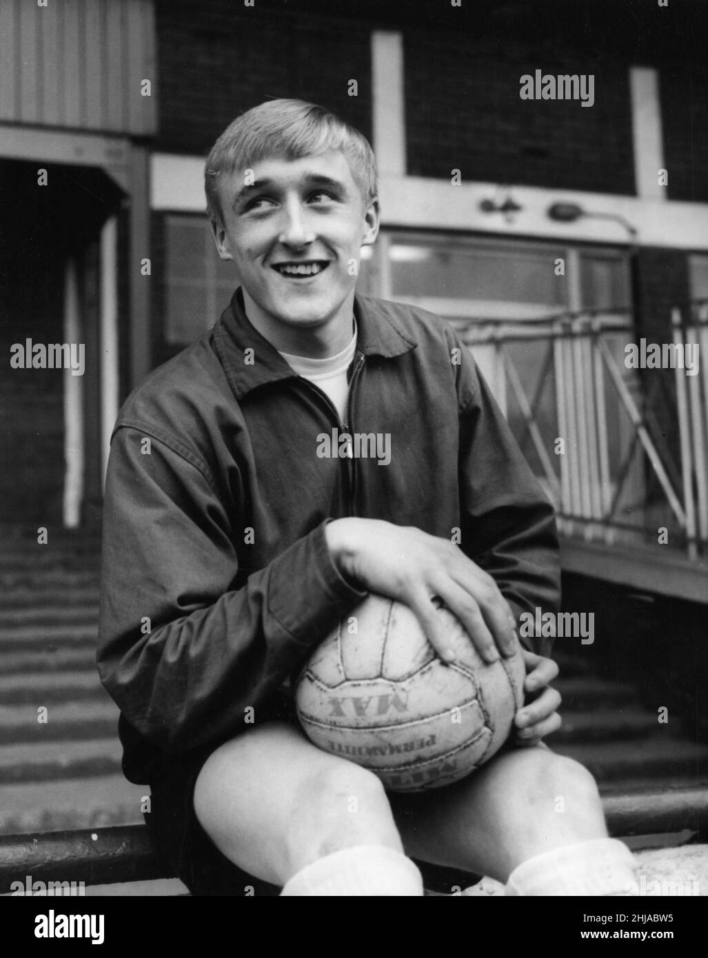 Derek Parkin fullback aged 16 year-old prepares to make his first senior appearance for Huddersfield Town against Bury, November 1964. *** Local Caption *** football player Stock Photo