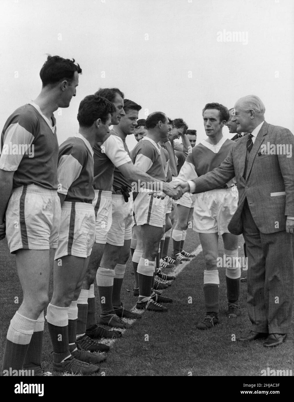 The opening of Woodford Park sports ground Woodley by Lord Luke, Chairman of the National Playing Fields Association. Our Picture Shows: Lord Luke being presented to one of the football teams taking part in the opening ceremony. 15th April 1964 Stock Photo