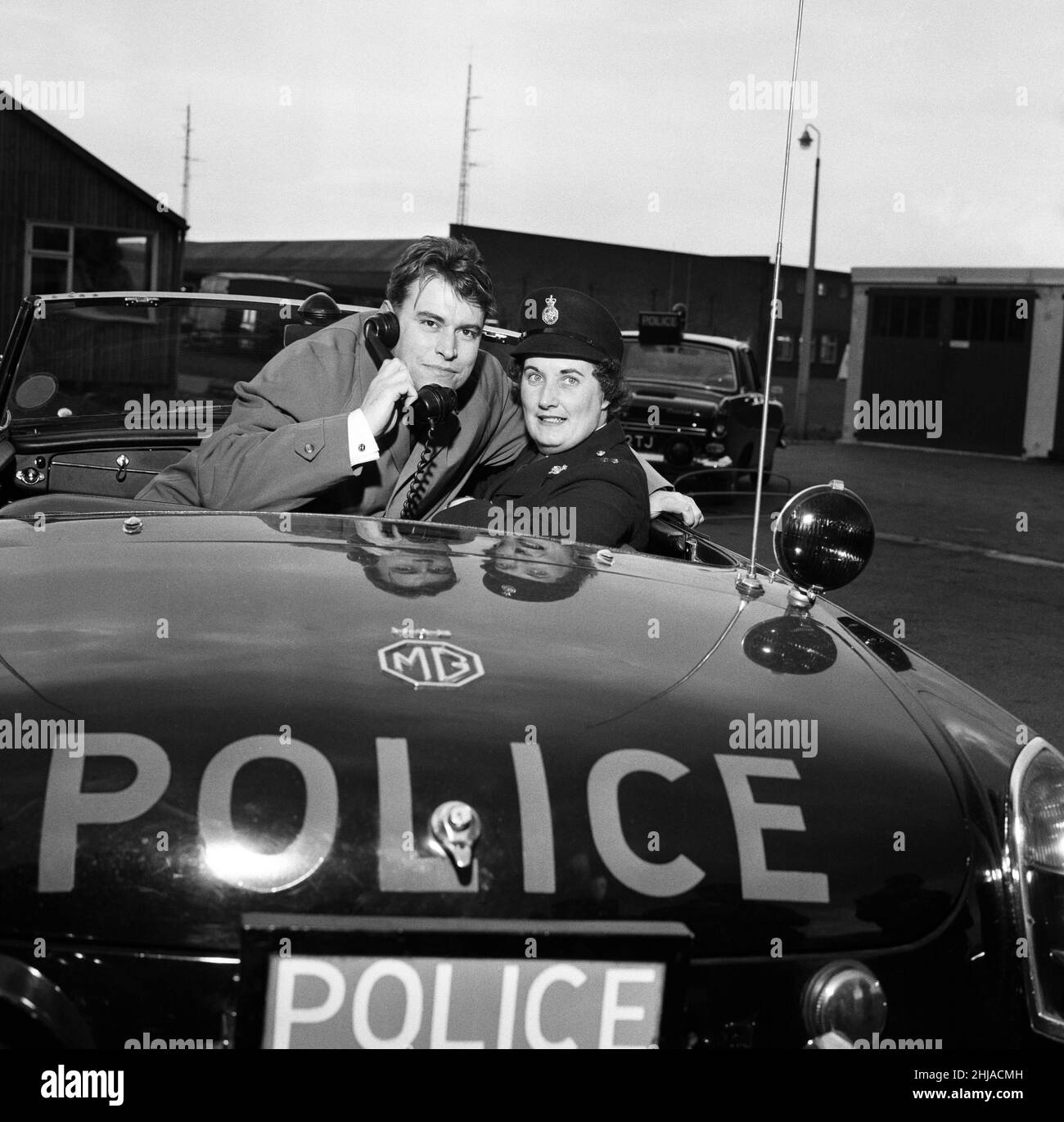 Some of the cast of the Z-Car series on a tour of the Police Headquarters at Hutton, near Preston. Pictured, Brian Blessed who plays PC Frances Smith in Z-Cars meets Winifred Cross, 23, of the transport police. March 1964. Stock Photo