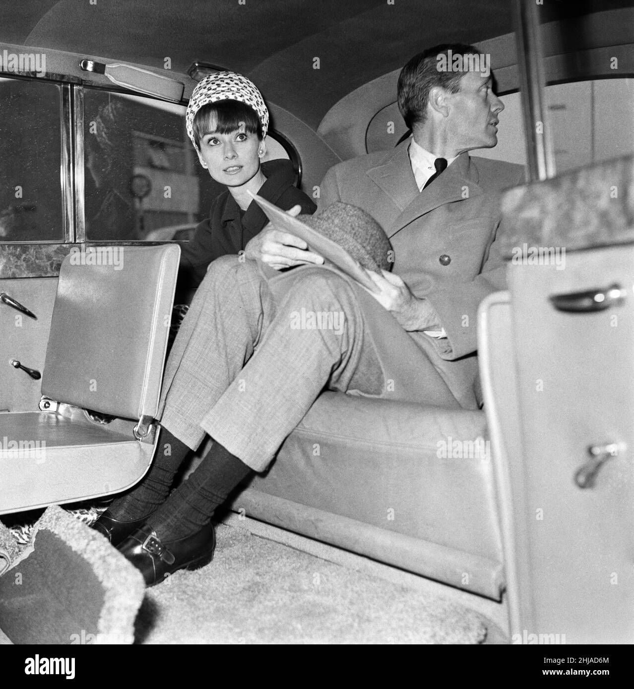 Actress Audrey Hepburn and her husband Mel Ferrer in the back of a car
