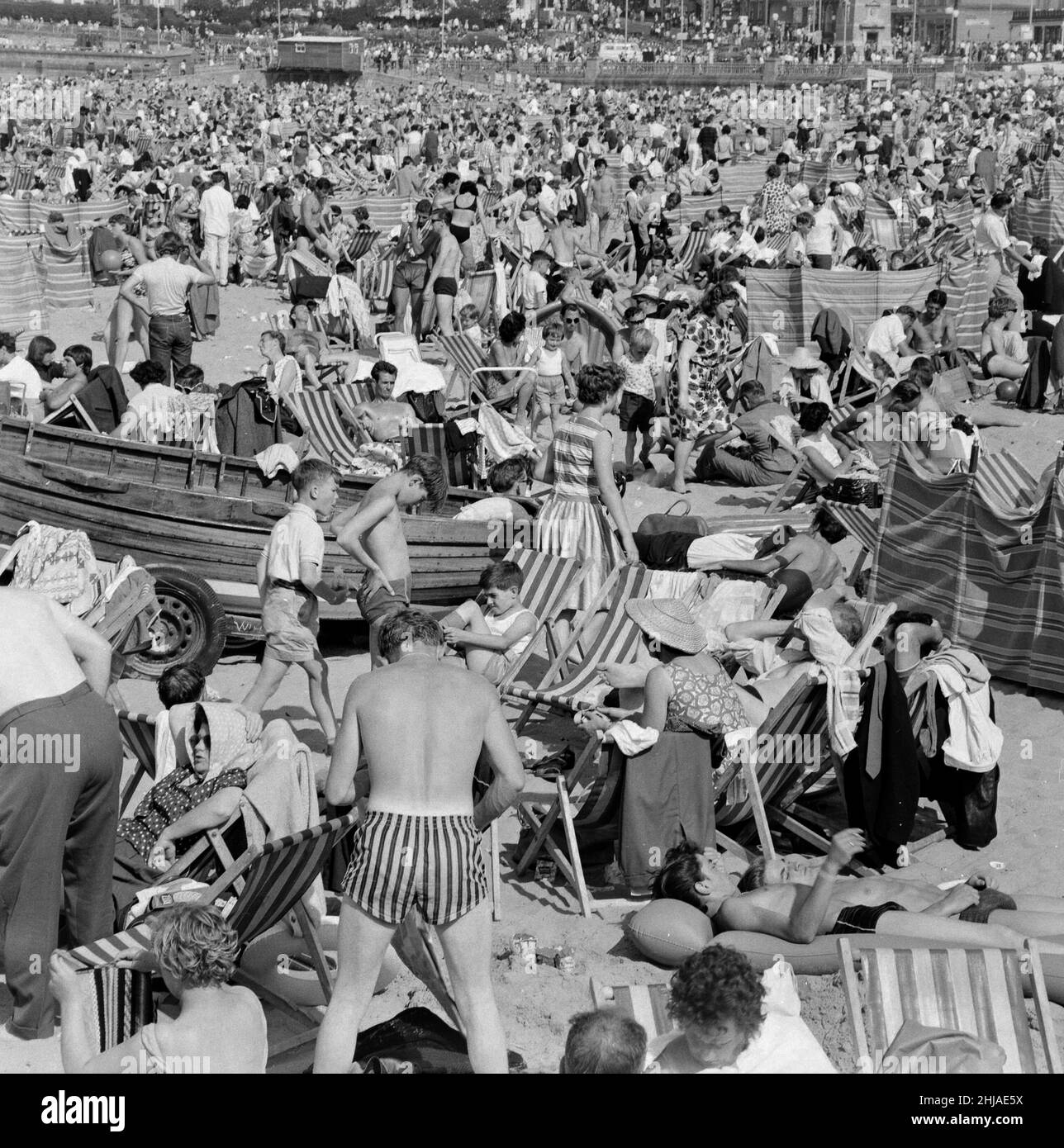 Crowded beach at Margate with holiday makers enjoying the sun. 4th August 1964. Stock Photo