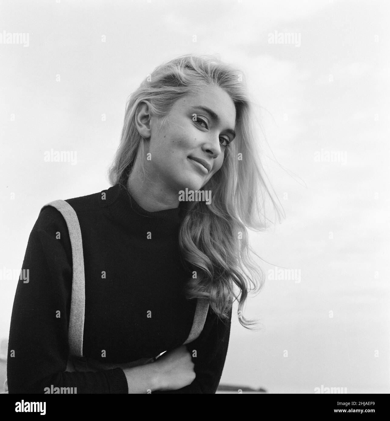 Alexandra Bastedo, 18 years old actress from Hove, Sussex, Friday 18th December 1964. Alex has recently appeared in The Count of Monte Cristo, television series as character Renée de Saint-Méran.  Pictured posing for pictures on beach at Hove. Stock Photo