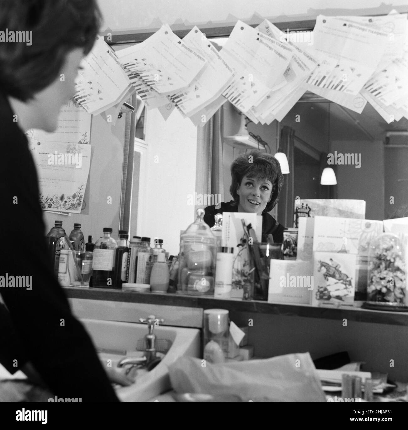 28 year old actress Maggie Smith in her dressing room, looking at the