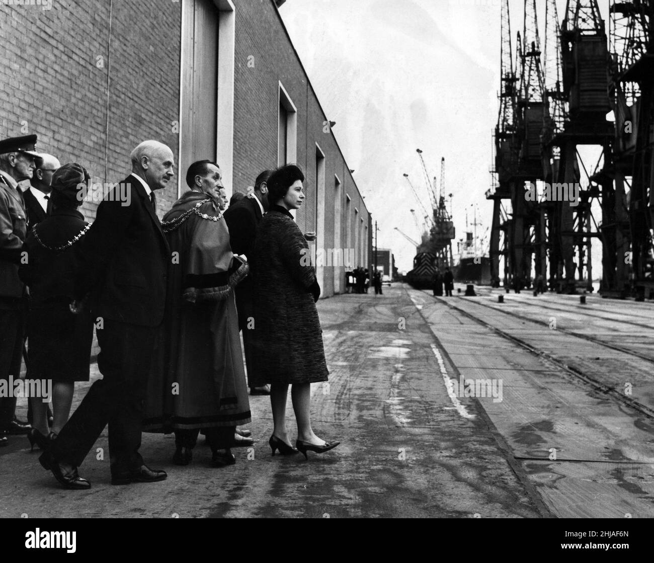 The Queen and the Mayor of Newport look across Newport Docks at
