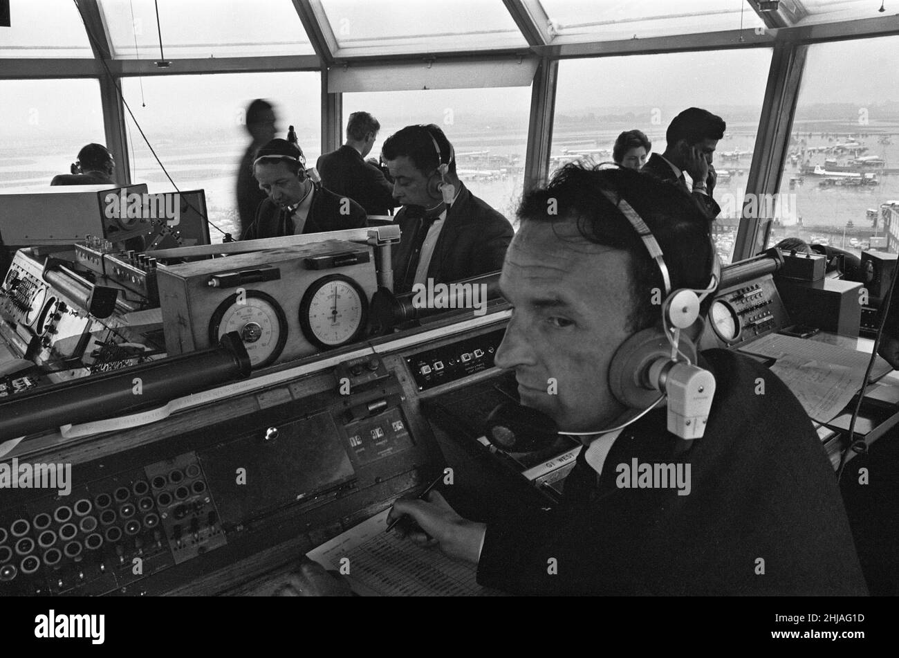Air traffic controllers in the control tower at Heathrow Airport