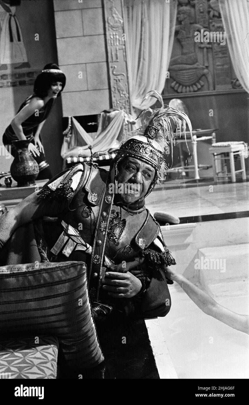 Sid James on the set of 'Carry on Cleo' at Pinewood Studios, Buckinghamshire. 4th August 1964. Stock Photo