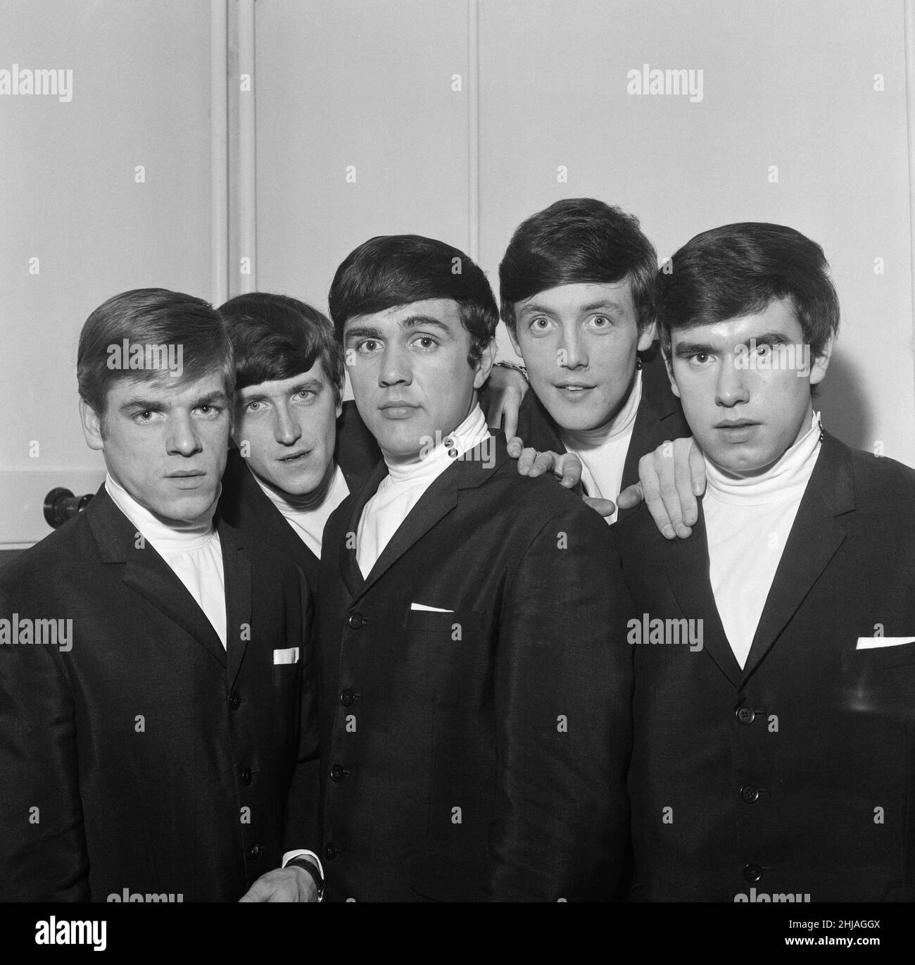 The Dave Clarke Five. Left to right: Lenny Davison (guitar) Rick Huxley (bass guitar) Dave Clark (drums) Mike Smith (lead vocals and keyboards organ) Denis Patton (saxophone)  When this picture was taken The Dave Clark Five were at the top of the charts with their hit 'Glad All Over'  Picture taken 8th January 1964 Stock Photo
