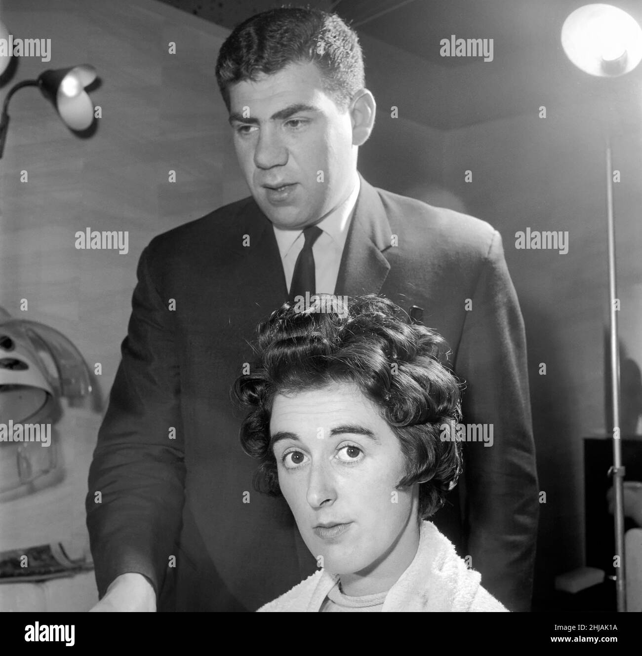 Woman have her hair cut and curled at the hair dressers 7th june 1962