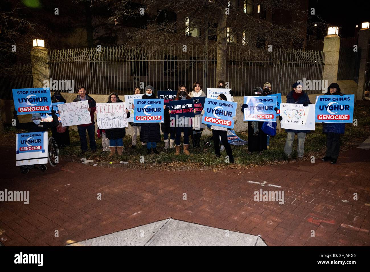 Washington, United States. 27th Jan, 2022. Protesters hold signs that say 'Stop China's Uyghur Genocide' and 'Stand up for Human Rights' at a protest at the Chinese Embassy against the Uyghur genocide and the Beijing Winter Olympics.The Uyghur Crisis Response Team of the Social Action Committee of Congregation Adas Israel in Washington, DC, sponsored the demonstration. Credit: SOPA Images Limited/Alamy Live News Stock Photo