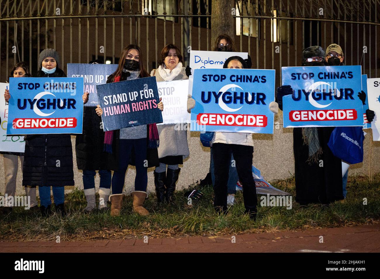 Washington, United States. 27th Jan, 2022. Protesters hold signs that say 'Stop China's Uyghur Genocide' and 'Stand up for Human Rights' at a protest at the Chinese Embassy against the Uyghur genocide and the Beijing Winter Olympics.The Uyghur Crisis Response Team of the Social Action Committee of Congregation Adas Israel in Washington, DC, sponsored the demonstration. Credit: SOPA Images Limited/Alamy Live News Stock Photo