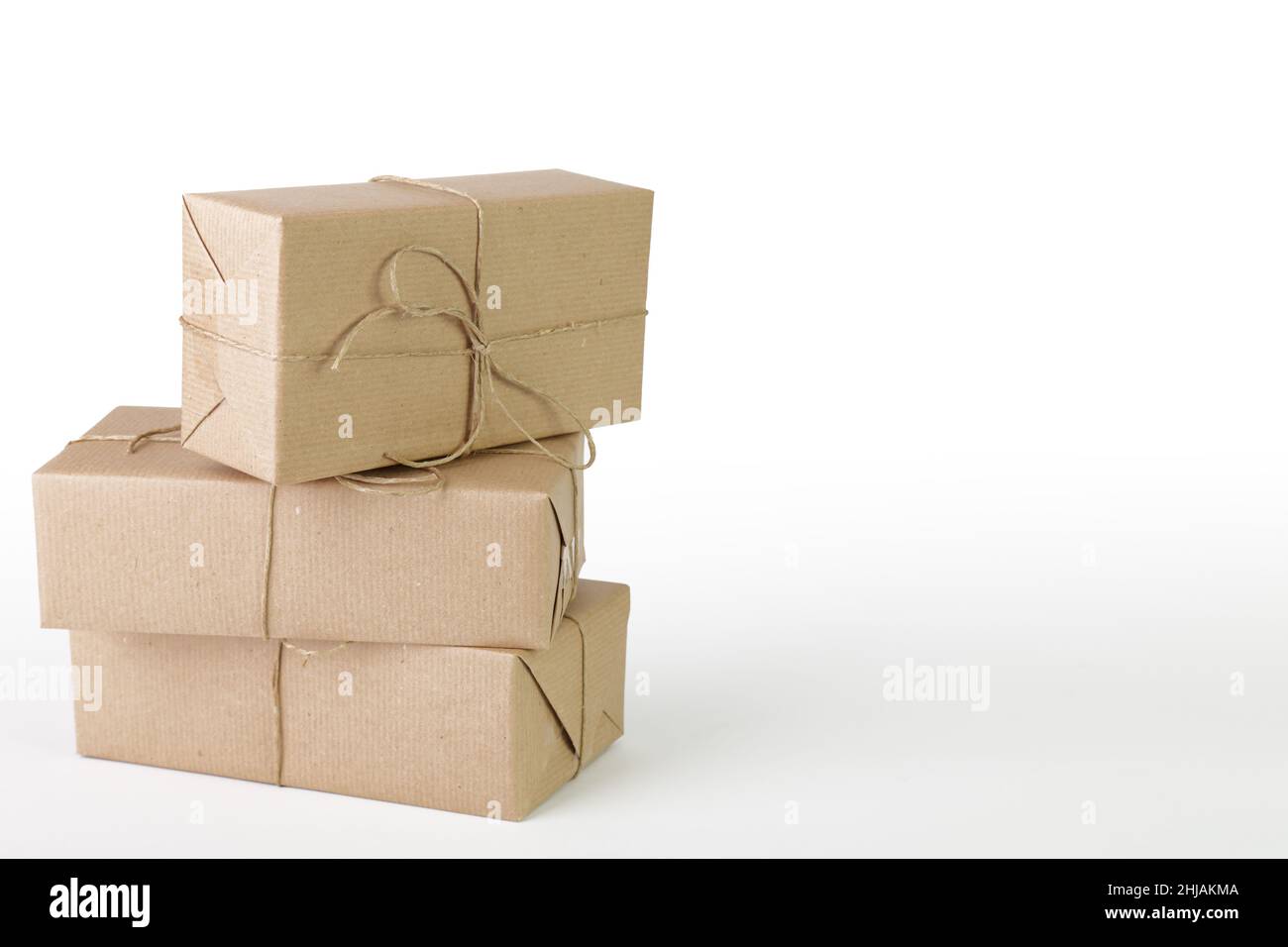 Three packages packed with wrapping paper on a white background Stock Photo Alamy