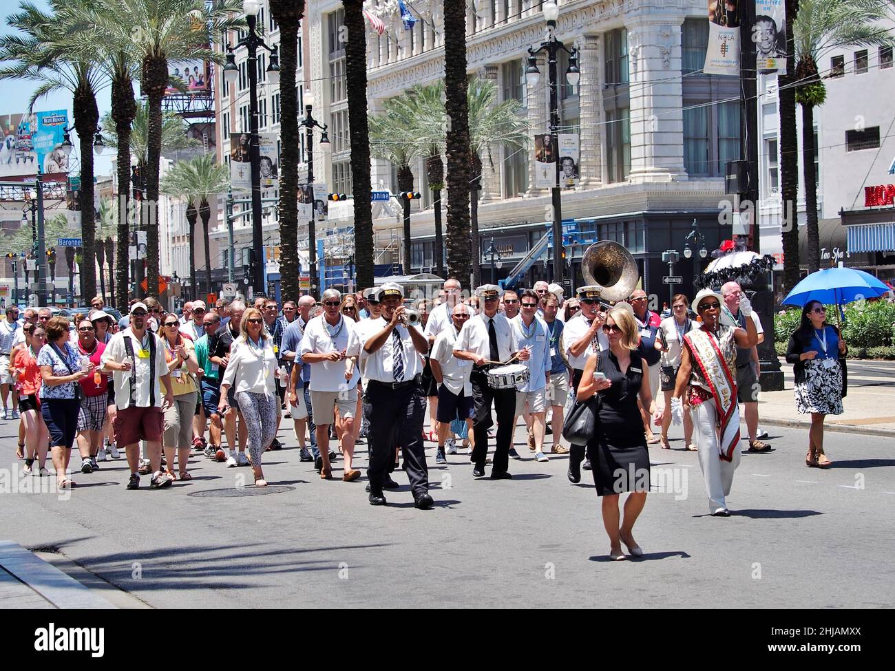 New Orleans, LA, USA - JULY 12, 2015: First and second line parade with local brass band and  conference attendees on Canal Street Stock Photo
