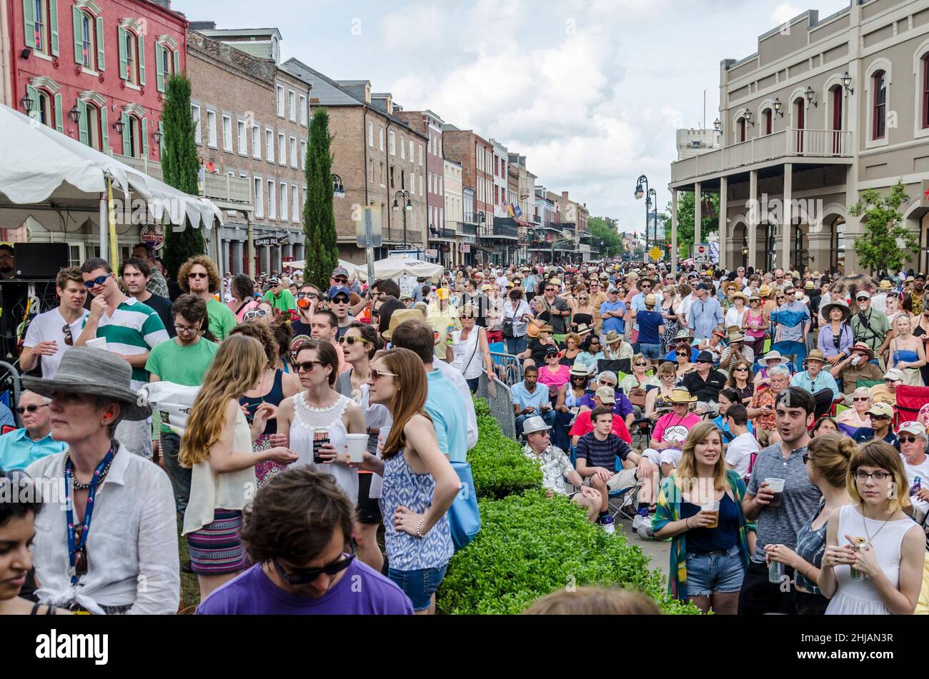 NEW ORLEANS, LA, USA - APRIL 13, 2014: Crowd Gathered at Decatur Street Stage at French Quarter Festival Stock Photo
