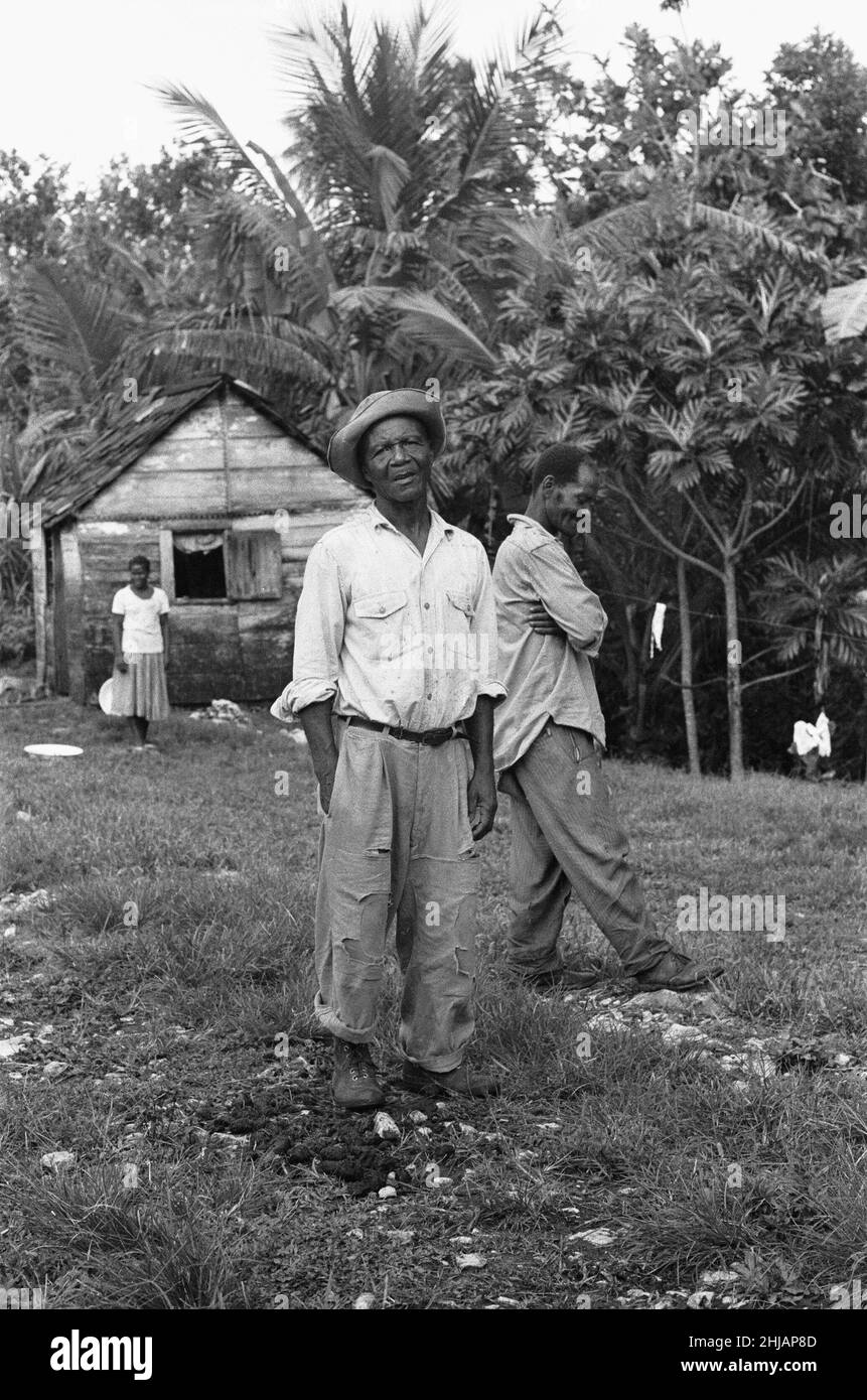 Jamaican Maroons pose for the camera outside their house in St Elizabeth. The Maroons are descendants of escaped slaves who established free communities in the mountainous interior of Jamaica during the era of slavery. 15th August 1962 Stock Photo