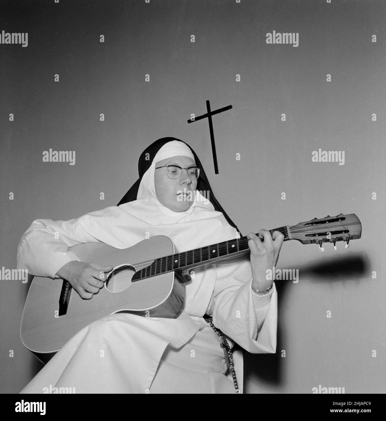 The Singing Nun, born Jeanne-Paule Marie Deckers, she is a nun at the Dominican Fichermont Convent in Fichermont, Belgium.   Pictured in convent December 1963    A.k.a.  Sister Luc Dominique  Sister Sourine  Jeanine Deckers  Soeur Sourire   Sister Smile Stock Photo