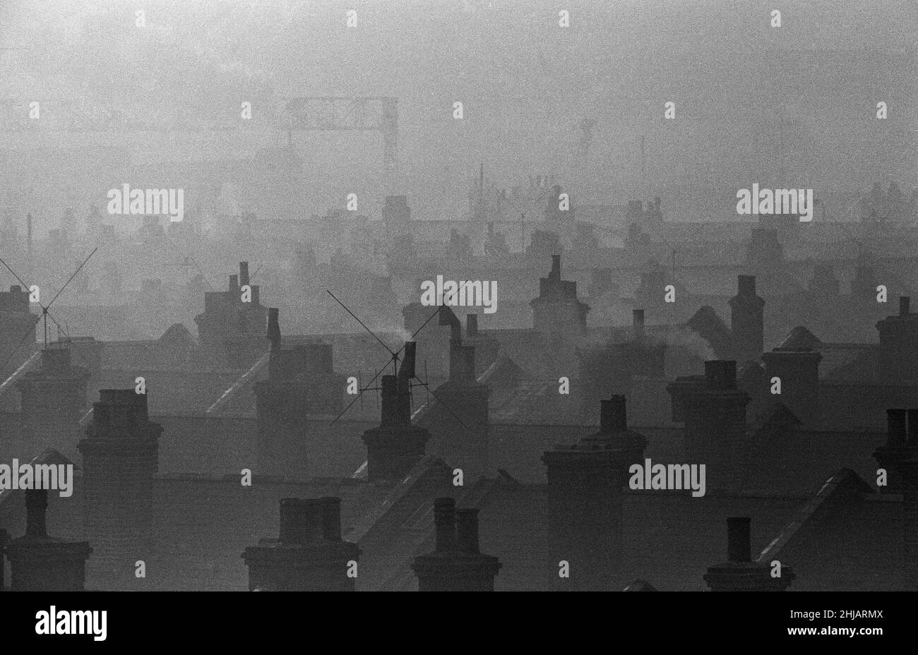 Smog caused by coal fires hangs over the roof tops of Battersea, London