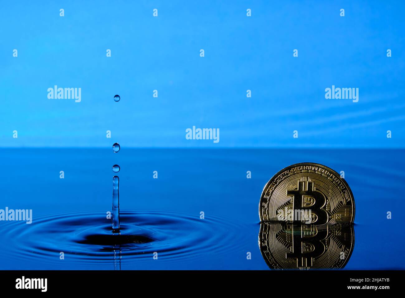 A bitcoin falling from the sky Stock Photo - Alamy