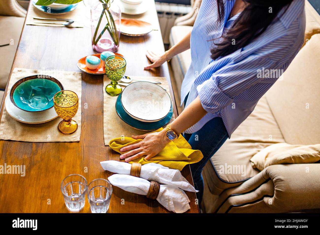 designer etiquette teacher showing how correct set a dishes in a restaurant Stock Photo