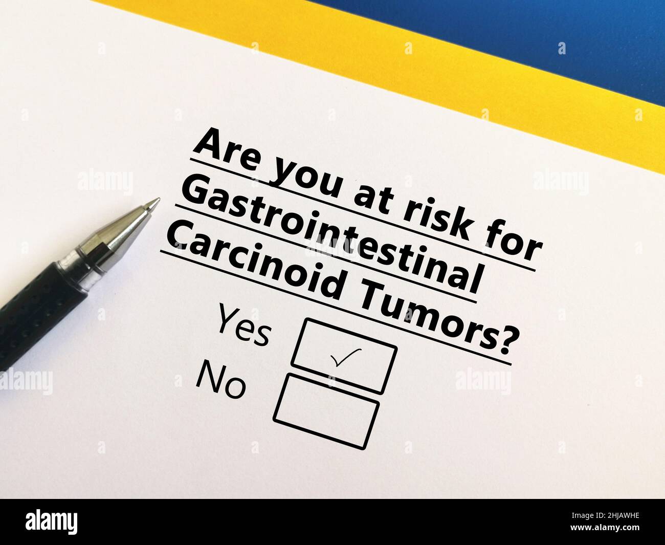 One person is answering question about cancer risk. He is at risk for gastrointestinal carcinoid tumours. Stock Photo