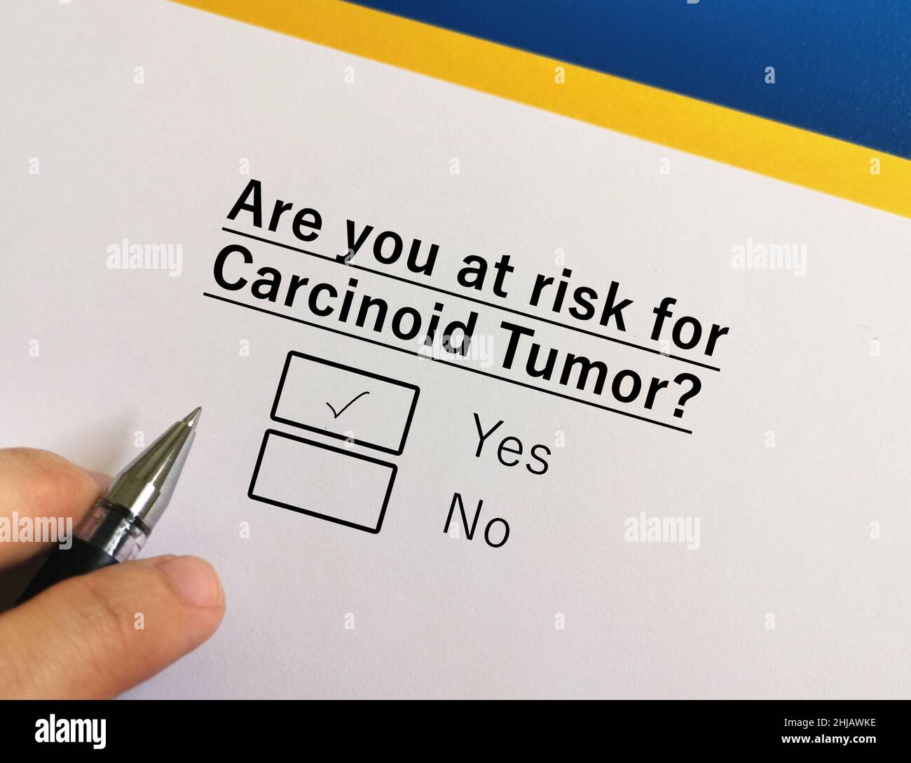 One person is answering question about cancer risk. He is at risk for carcinoid tumour. Stock Photo