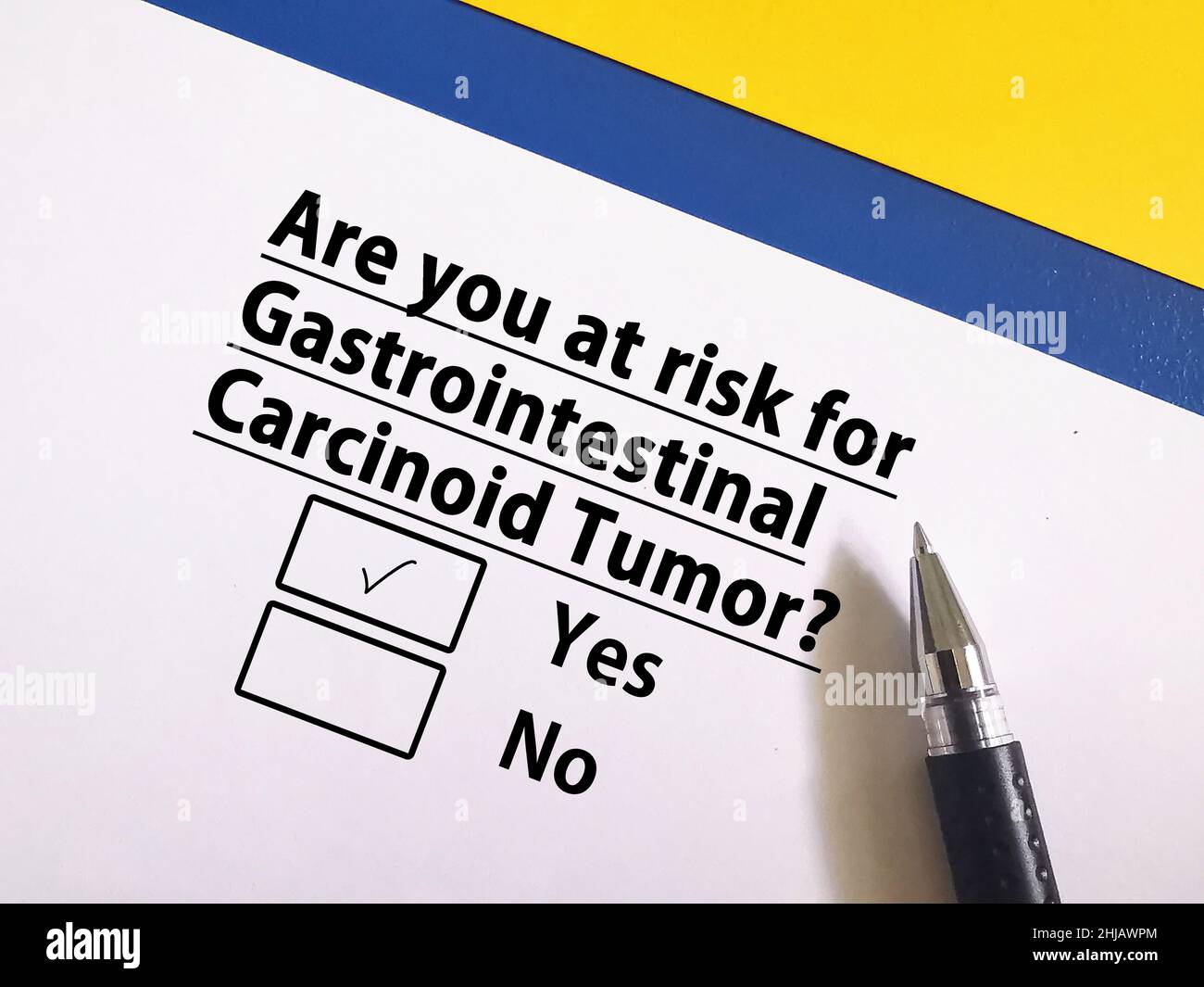 One person is answering question about cancer risk. He is at risk for gastrointestinal carcinoid tumour. Stock Photo