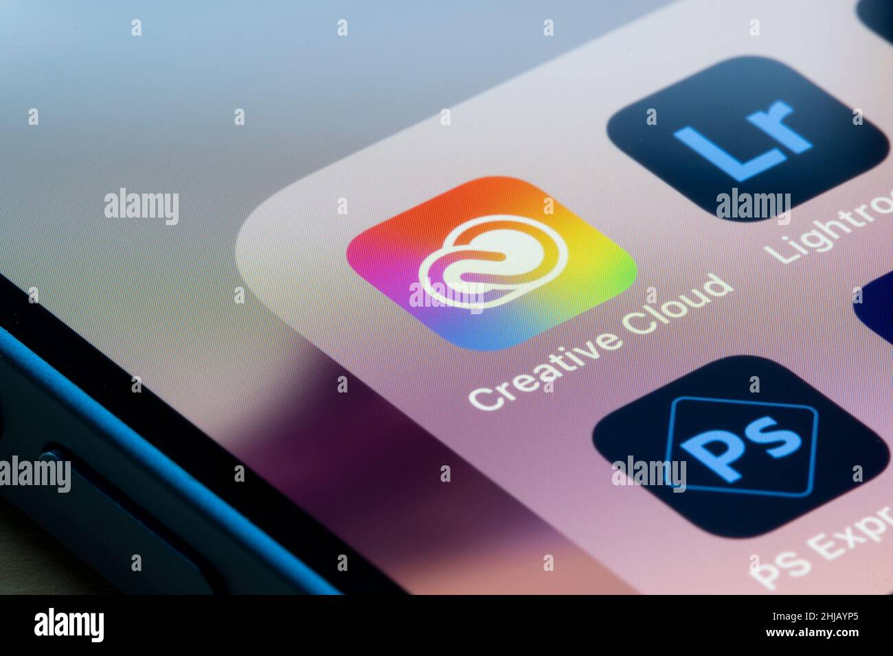 Adobe Creative Cloud, Lightroom and PS Express apps are seen on an iPhone. Adobe Creative Cloud is a set of applications and services from Adobe Inc. Stock Photo