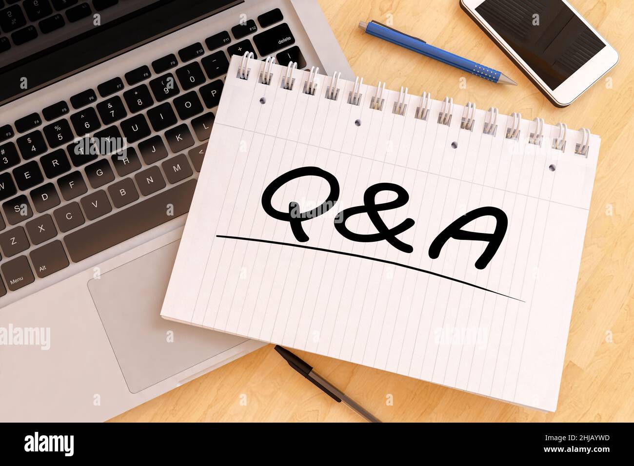 Q&A Questions and Answers handwritten text in a notebook on a desk