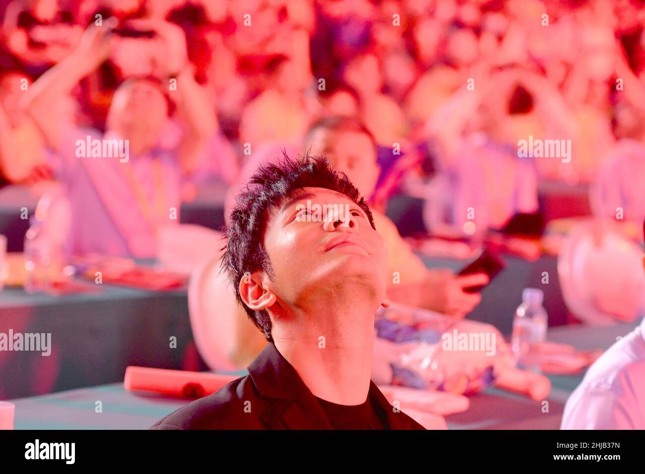 Actor Huang Xiaoming greets hometown residents during the opening ceremony of Qingdao International Beer Festival at the Golden Beach Beer City in the Stock Photo