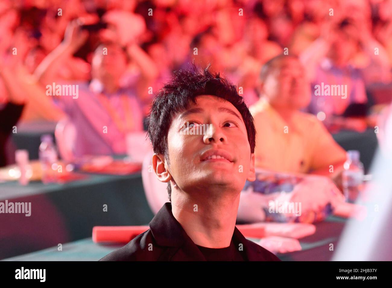 Actor Huang Xiaoming greets hometown residents during the opening ceremony of Qingdao International Beer Festival at the Golden Beach Beer City in the Stock Photo