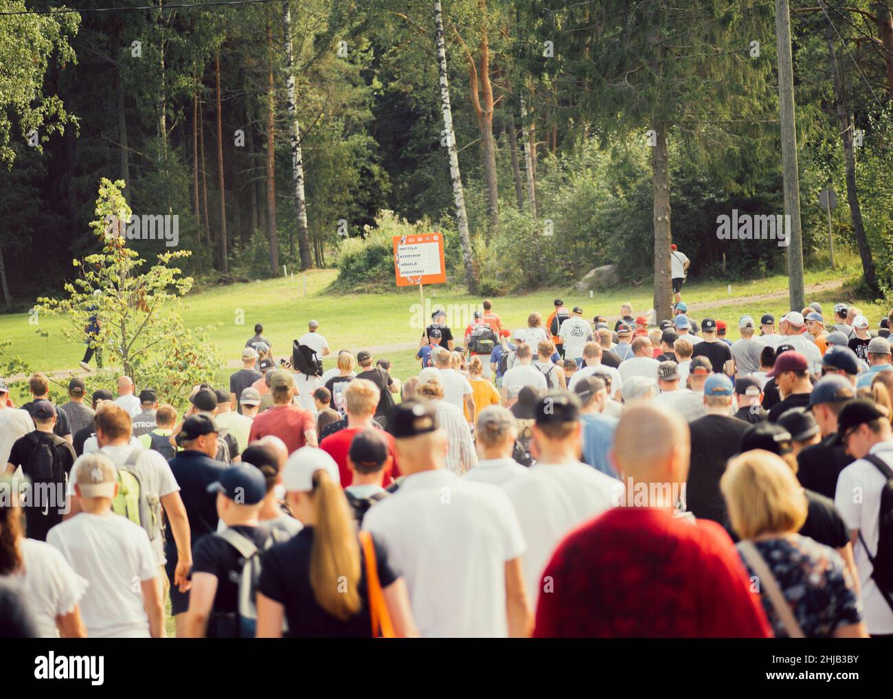 Group of people watching the Disc golf championships in Sipoo, Finland